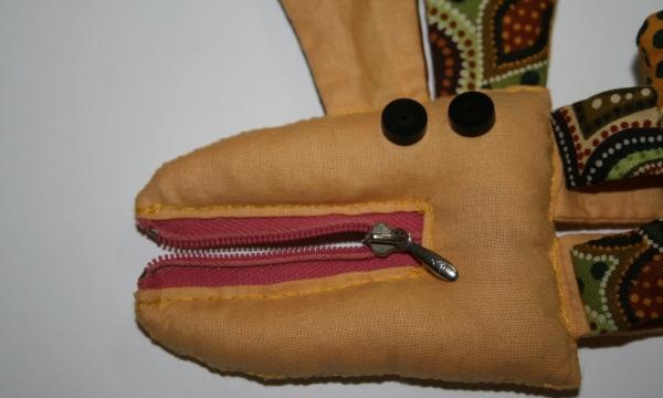 Let's start sewing on the zippers