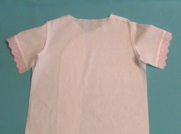 We sew a baptismal shirt