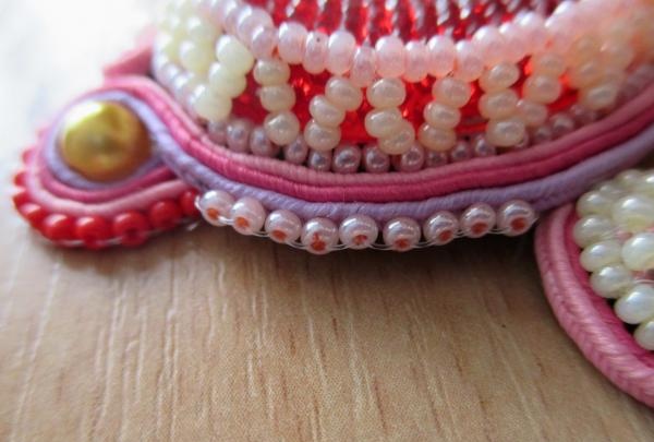 Sew on a row of beads