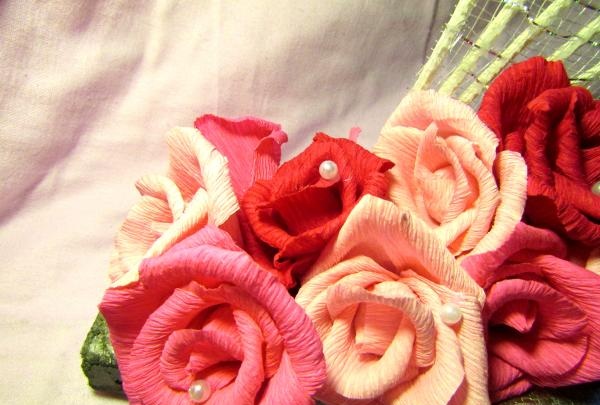 fans with roses made of corrugated paper