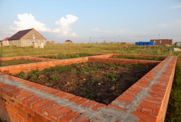 construction of a red brick plinth