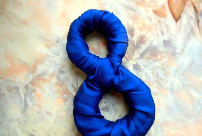 Figure eight made of foam rubber and satin ribbons