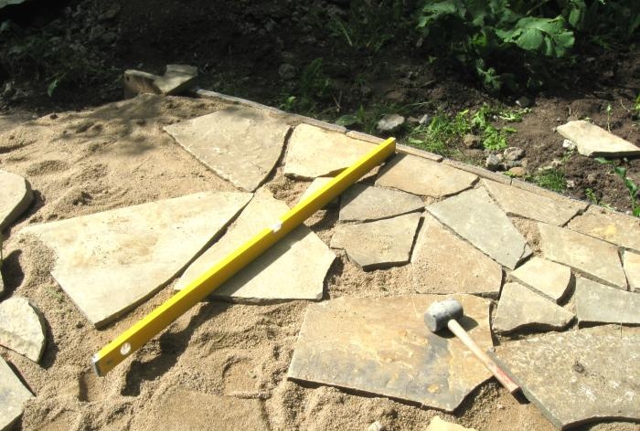 Laying the site with sandstone