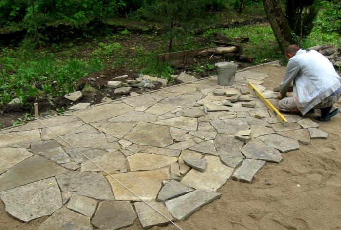 Laying the site with sandstone