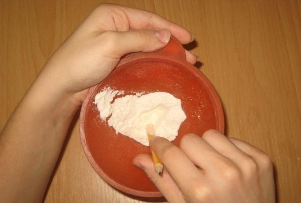 Pour some flour into the funnel