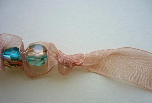 Bracelet made of ribbon and beads