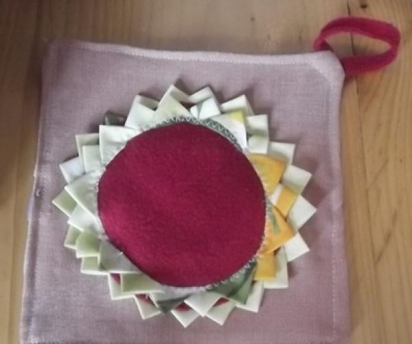 Kitchen oven mitts in the shape of a sun