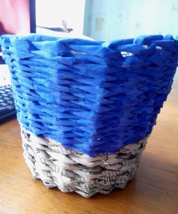 Flower pot made from newspaper tubes