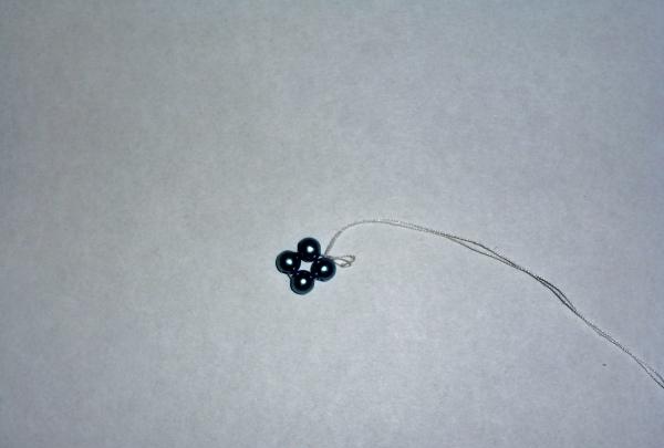 string 4 beads onto a thread