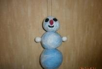 Snowman made of wool using the felting method