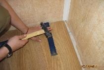 Floor repair, laminate flooring and baseboard installation