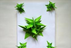 Decorating a gift with origami flowers