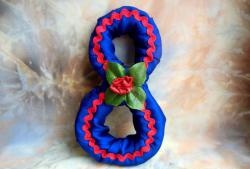 Figure eight made of foam rubber and satin ribbons