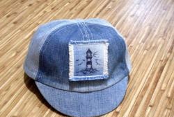 We sew a denim baseball cap for a baby