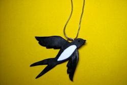 Pendants in the shape of a swallow