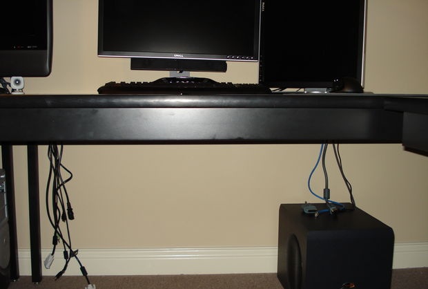 Hiding wires under a computer desk