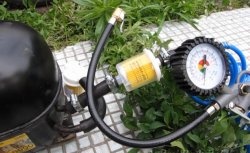 Refrigerator compressor for inflating tires