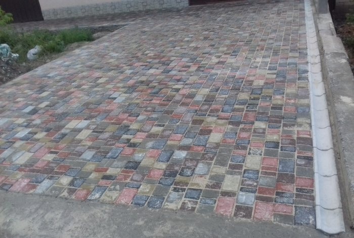 Driveway to the house made of paving slabs