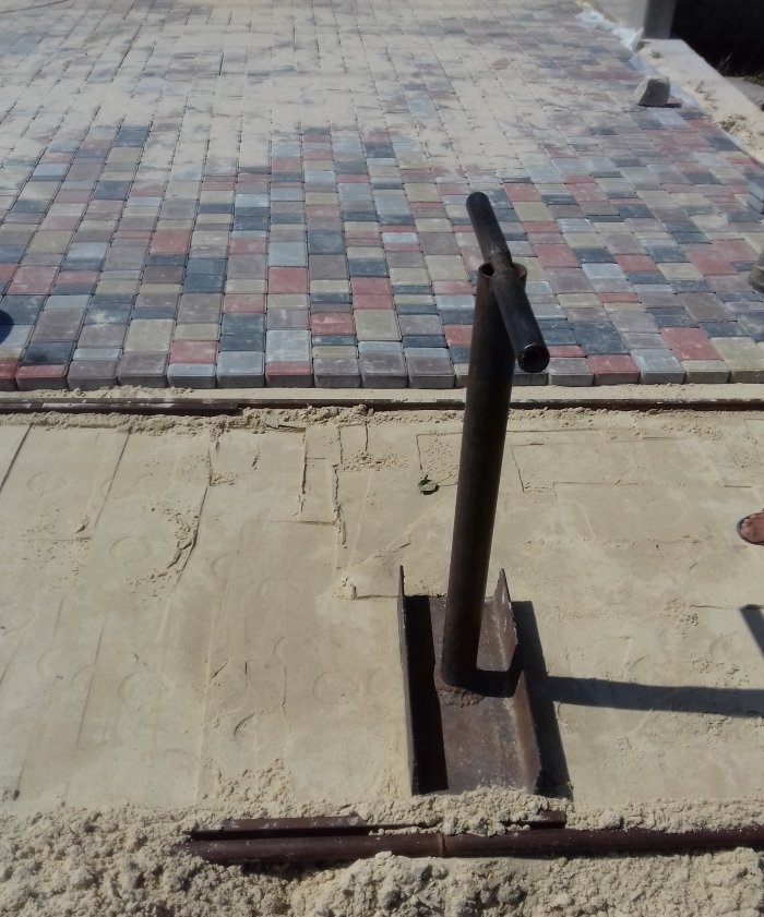 Driveway to the house made of paving slabs