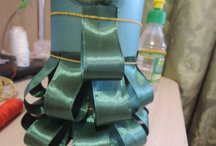 Champagne dressed up as a Christmas tree for the New Year's table