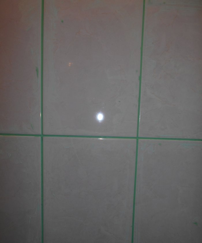 Grouting joints between tiles