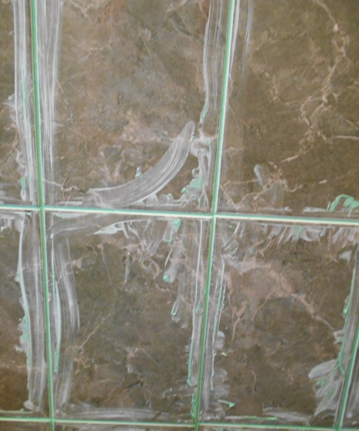 Grouting joints between tiles