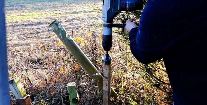 Hammers wooden stakes with a hammer drill