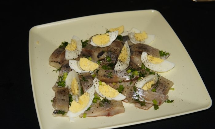 Russian salad of lightly salted herring and eggs