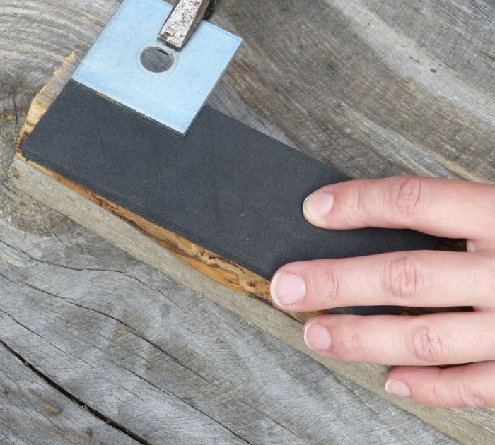 A homemade brush made from recycled materials that doesn't allow debris to stick to it.