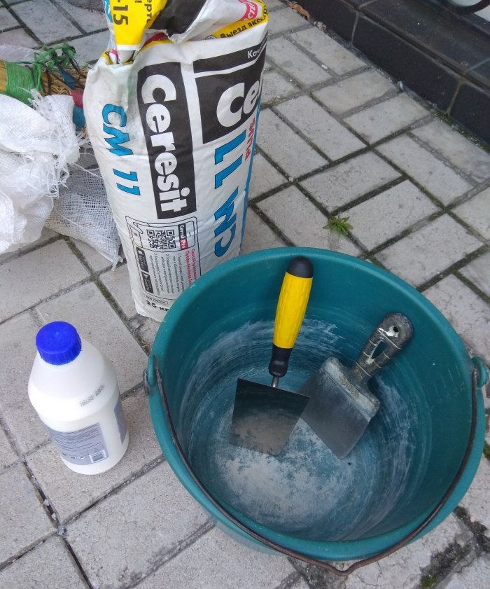 Removing old tiles and laying new tiles on threshold steps