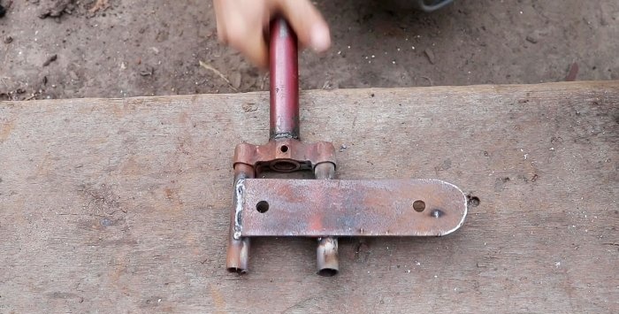 A simple stand for an angle grinder made from a bicycle