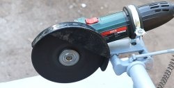 A simple stand for an angle grinder made from a bicycle