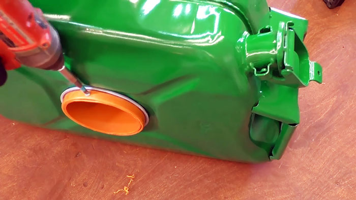 DIY case for a watering hose from an old canister