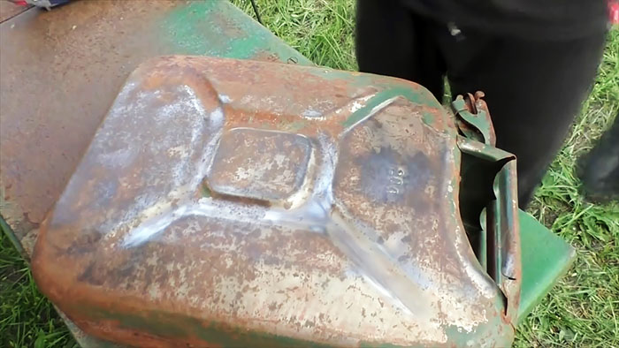 DIY case for a watering hose from an old canister