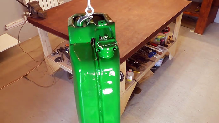 DIY case for a watering hose from an old canister