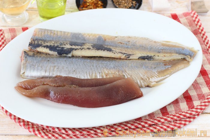 Herring marinated in a jar with spices and lemon