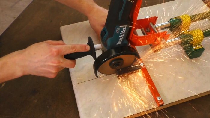 Stand for an angle grinder made from the handle of a children's bicycle