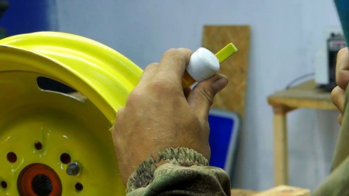 DIY garden hose reel from a car wheel