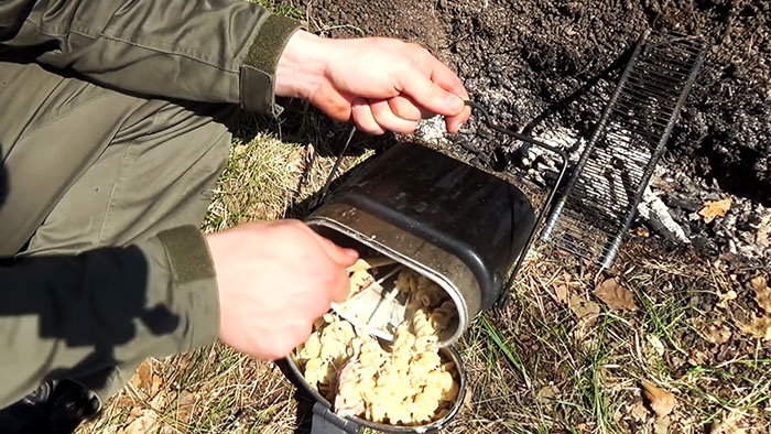 Picnic in nature delicious pasta on the fire