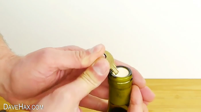 Another tricky way to open a bottle without a corkscrew