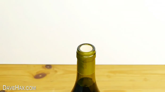 Another tricky way to open a bottle without a corkscrew