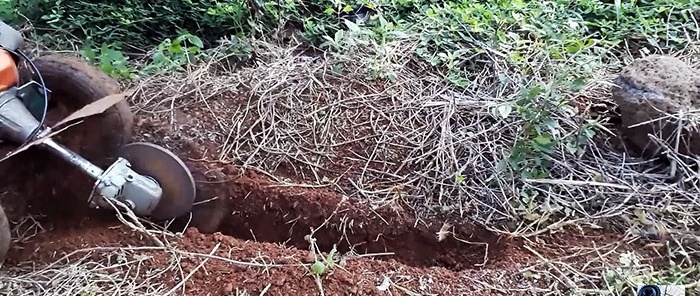 DIY trencher made from a brush cutter and a broken grinder