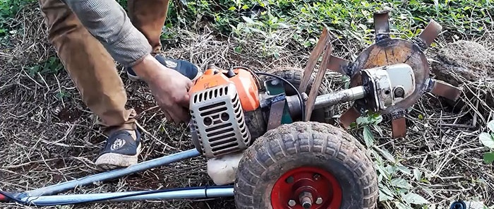 DIY trencher made from a brush cutter and a broken grinder