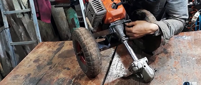 DIY trencher made from a brush cutter and a broken grinder