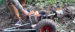 DIY trencher made from a brush cutter and a broken grinder