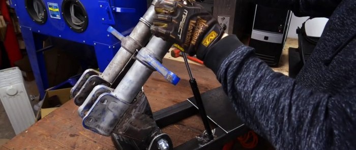 How to make a cutting machine from an angle grinder and old shock absorbers