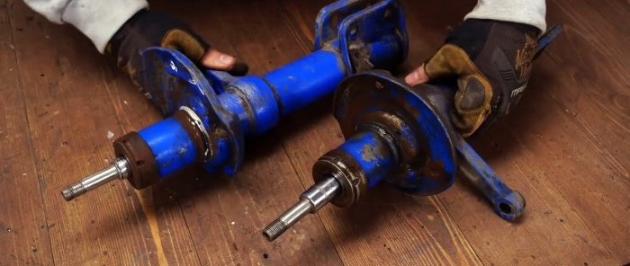 How to make a cutting machine from an angle grinder and old shock absorbers