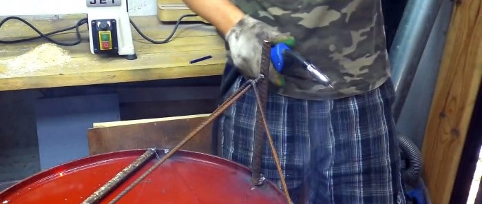 Making a mobile stove out of a barrel for burning garden waste