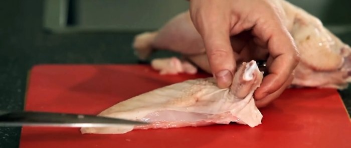 A chef shows how chicken is cut in the best restaurants