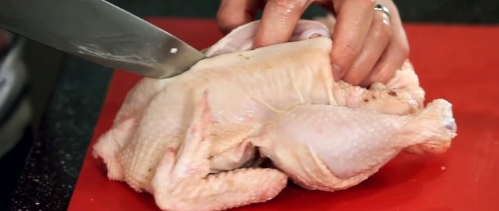 A chef shows how chicken is cut in the best restaurants